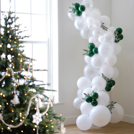 WHITE & DARK GREEN SNOWY CHRISTMAS BALLOON ARCH WITH FROSTED FOLIAGE